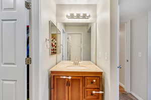 Bathroom with baseboards and vanity