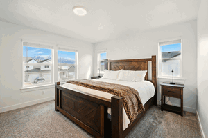 Carpeted bedroom featuring baseboards