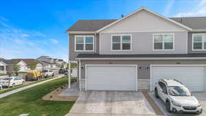 Garage with a residential view and concrete driveway