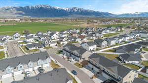Birds eye view of property featuring a mountain view and a residential view