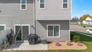 Rear view of property with a patio area and cooling unit