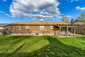 Back of property featuring a patio area, a fenced backyard, brick siding, and central air condition unit