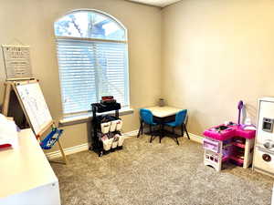 Game room featuring carpet flooring and baseboards