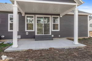Exterior space with a patio and entry steps