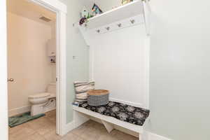 Mudroom with visible vents, baseboards, and light tile patterned floors