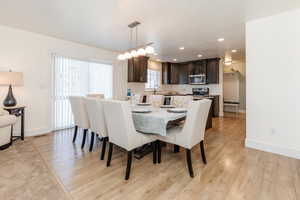Dining room featuring recessed lighting, baseboards, visible vents, and light wood-style flooring