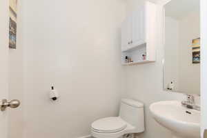 Bathroom featuring toilet and a sink