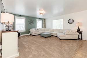 Living room featuring wood finished floors and baseboards