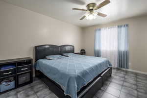 Bedroom featuring baseboards and a ceiling fan