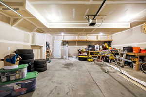 Garage with a garage door opener and a workshop area