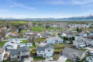Aerial view featuring a Wellsville Mountains view and a residential view