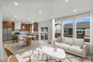 Living area featuring recessed lighting, light wood-type flooring, and a healthy amount of sunlight