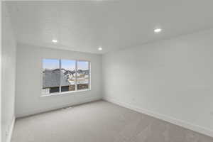 Living room featuring mountain views, light carpet, and recessed lighting