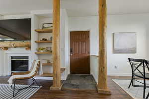 Foyer entrance front door with wood beams.