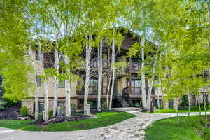 View of property featuring stairs