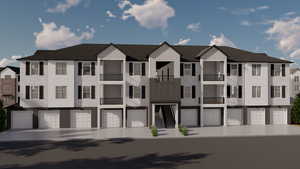 View of property featuring an attached garage
