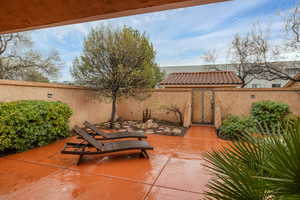 View of patio / terrace with fence and a gate