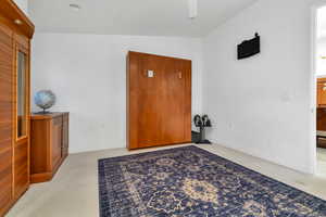 Entryway with light colored carpet and ceiling fan