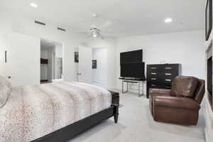 Bedroom featuring recessed lighting, ceiling fan, visible vents, and light carpet