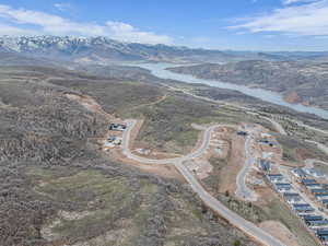 Drone / aerial view with a water and mountain view