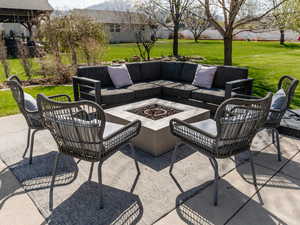 View of patio / terrace with an outdoor living space with a fire pit