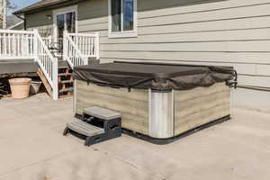 View of patio / terrace featuring a hot tub