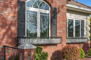 View of side of property featuring brick siding