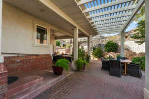 View of patio / terrace featuring outdoor dining area, a pergola, and a fenced backyard