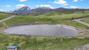 Aerial view of the community pond/ beach area and Wellsville mountain range.