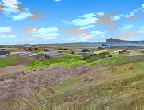 Birds eye view of property featuring a mountain view and a rural view