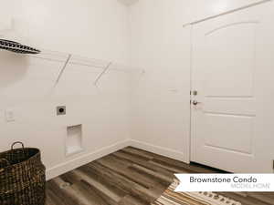 Clothes washing area with electric dryer hookup, baseboards, dark wood-style floors, and laundry area