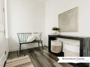 Office space with baseboards and wood finished floors