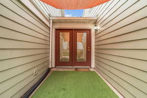 Side entrance to property with french doors