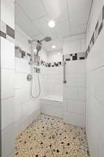 Bathroom featuring tiled shower