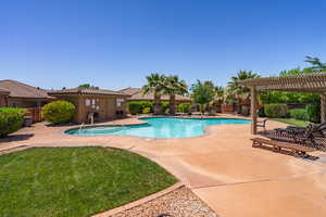 Community pool with a pergola and a patio