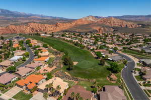 Drone / aerial view featuring a residential view, view of golf course, and a mountain view