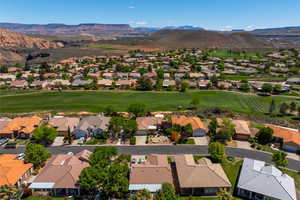 Birds eye view of property featuring a mountain view, a residential view, and golf course view