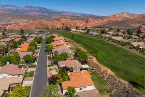 Aerial view with a mountain view, golf course view, and a residential view