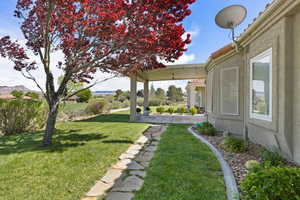 View of yard with a patio