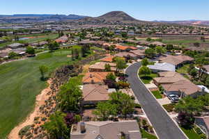 Birds eye view of property with a mountain view, a residential view, and view of golf course