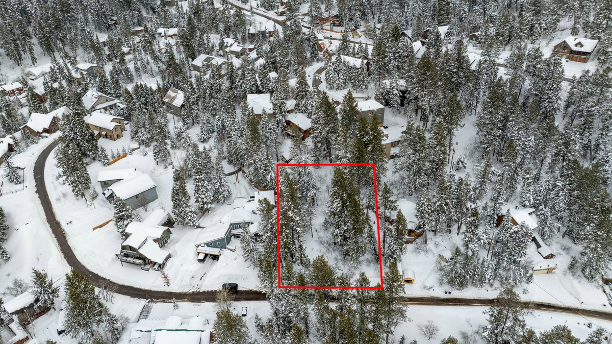 Snowy aerial view featuring a residential view