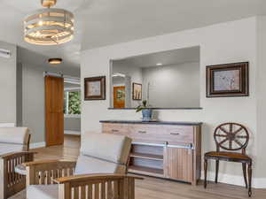 View of wall cut out of office into main living space