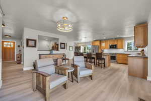 Seating area off kitchen facing deck that could be used for living space or formal dining
