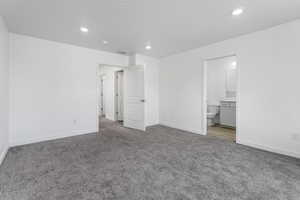 Unfurnished bedroom featuring recessed lighting, baseboards, visible vents, and carpet