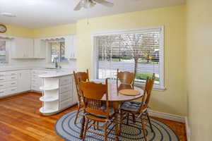 Dining area featuring light wood-style floors and ceiling fan