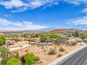 Property view of mountains with a residential view