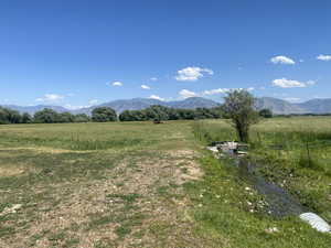 View of mountain background featuring rural landscape