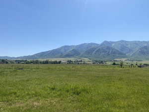 View of mountain background featuring rural landscape