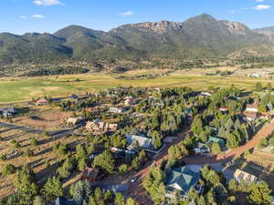 Birds eye view of property with a mountain view
