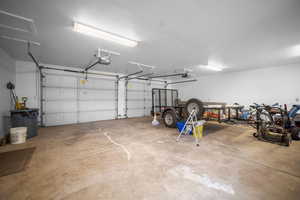Garage featuring a garage door opener